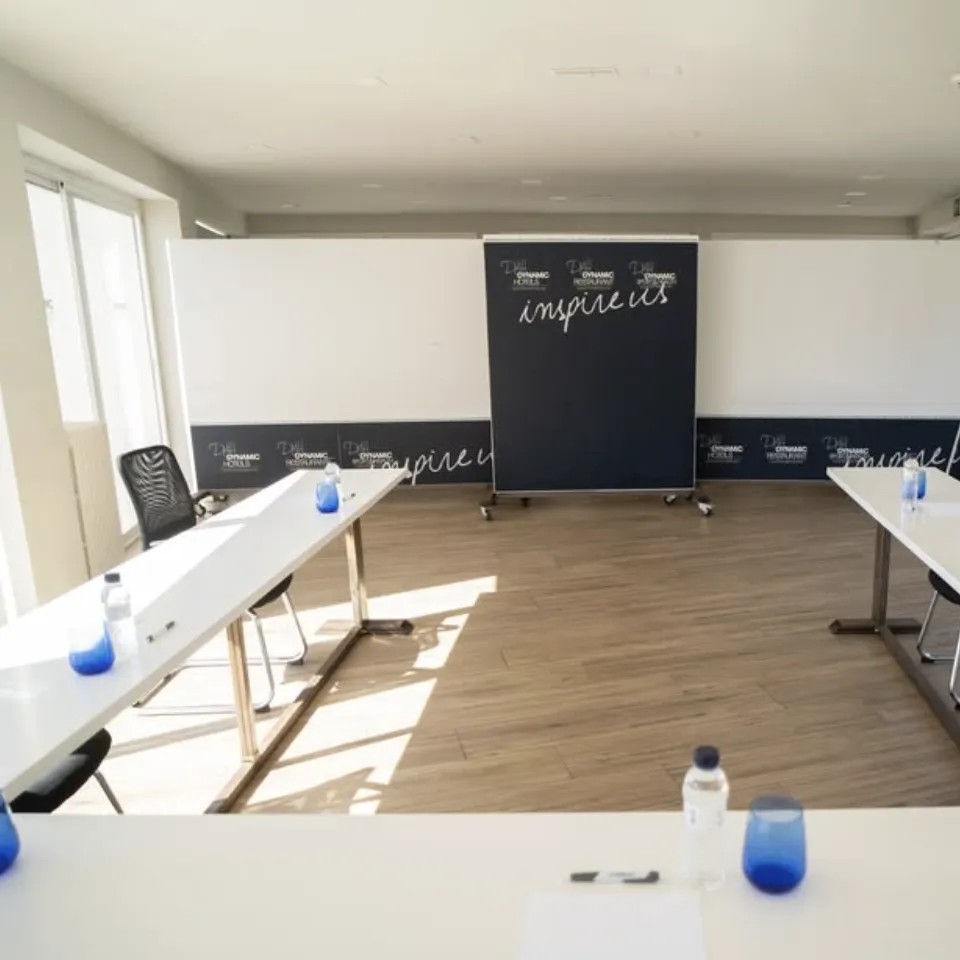 Meeting room equipped with projector and tables
